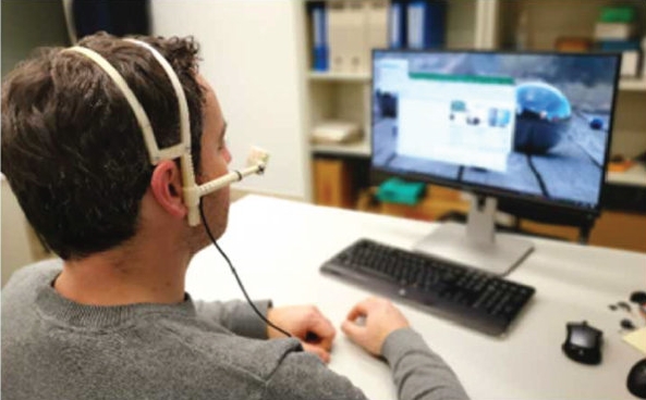 A disabled person is controlling a mouse with his eyeball